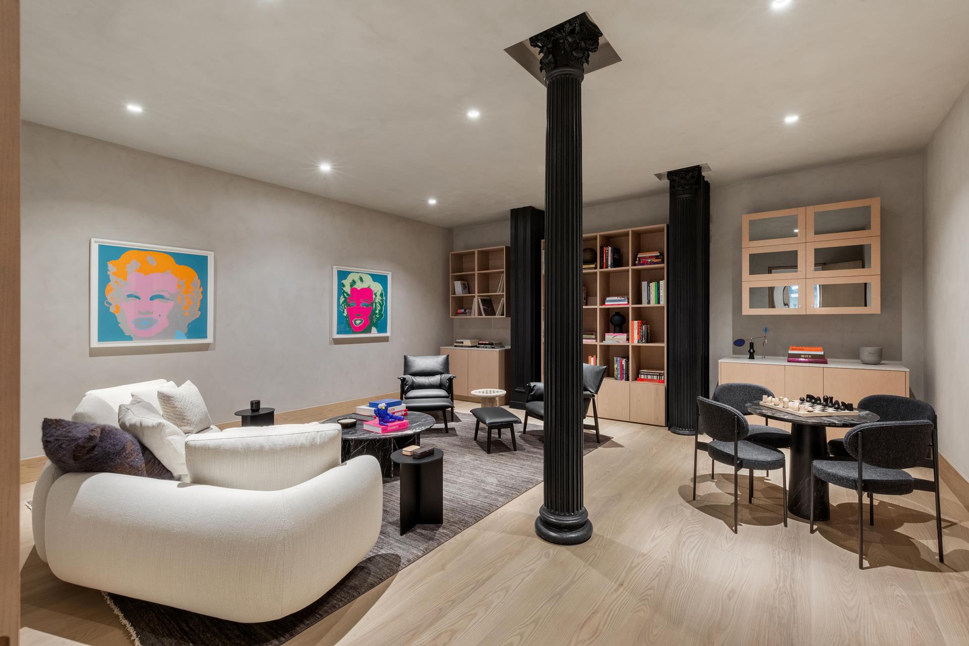 85 Worth Street, Unit 5 Manhattan, NY 10013 - Photo 15 of 20 a living room with furniture and a flat screen tv