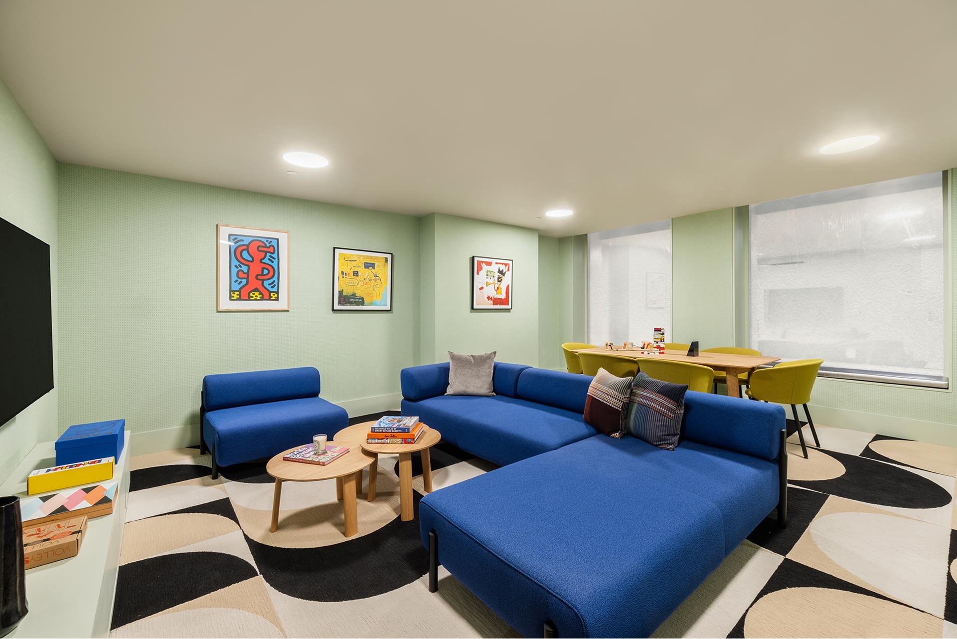 85 Worth Street, Unit 5 Manhattan, NY 10013 - Photo 18 of 20 a living room with furniture and a flat screen tv