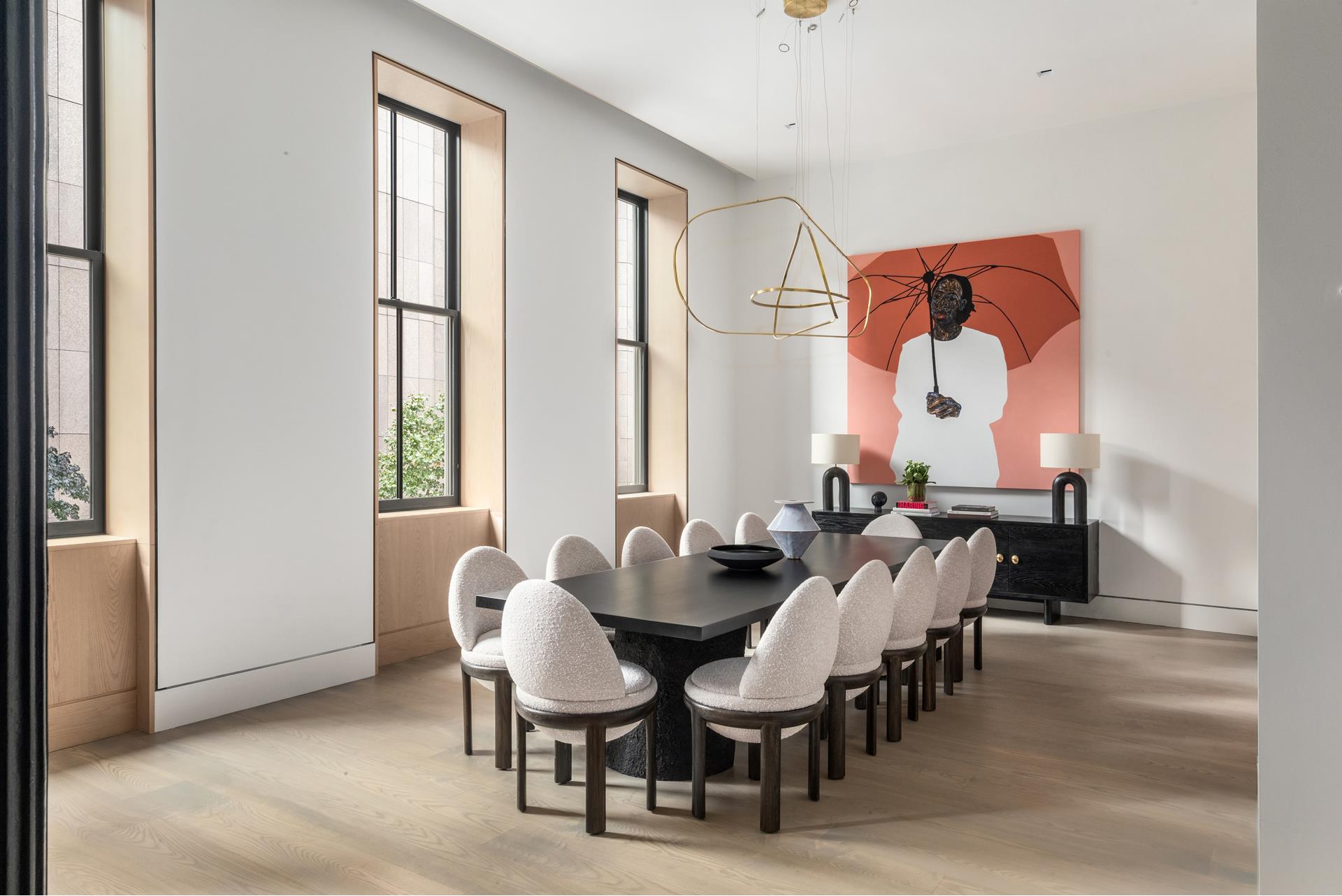 85 Worth Street, Unit 5 Manhattan, NY 10013 - Photo 2 of 20 a view of dining room and livingroom with furniture wooden floor a rug and a painting
