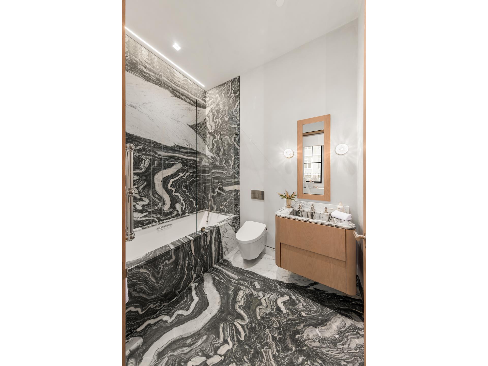 85 Worth Street, Unit 5 Manhattan, NY 10013 - Photo 7 of 20 a bathroom with a sink a toilet and shower