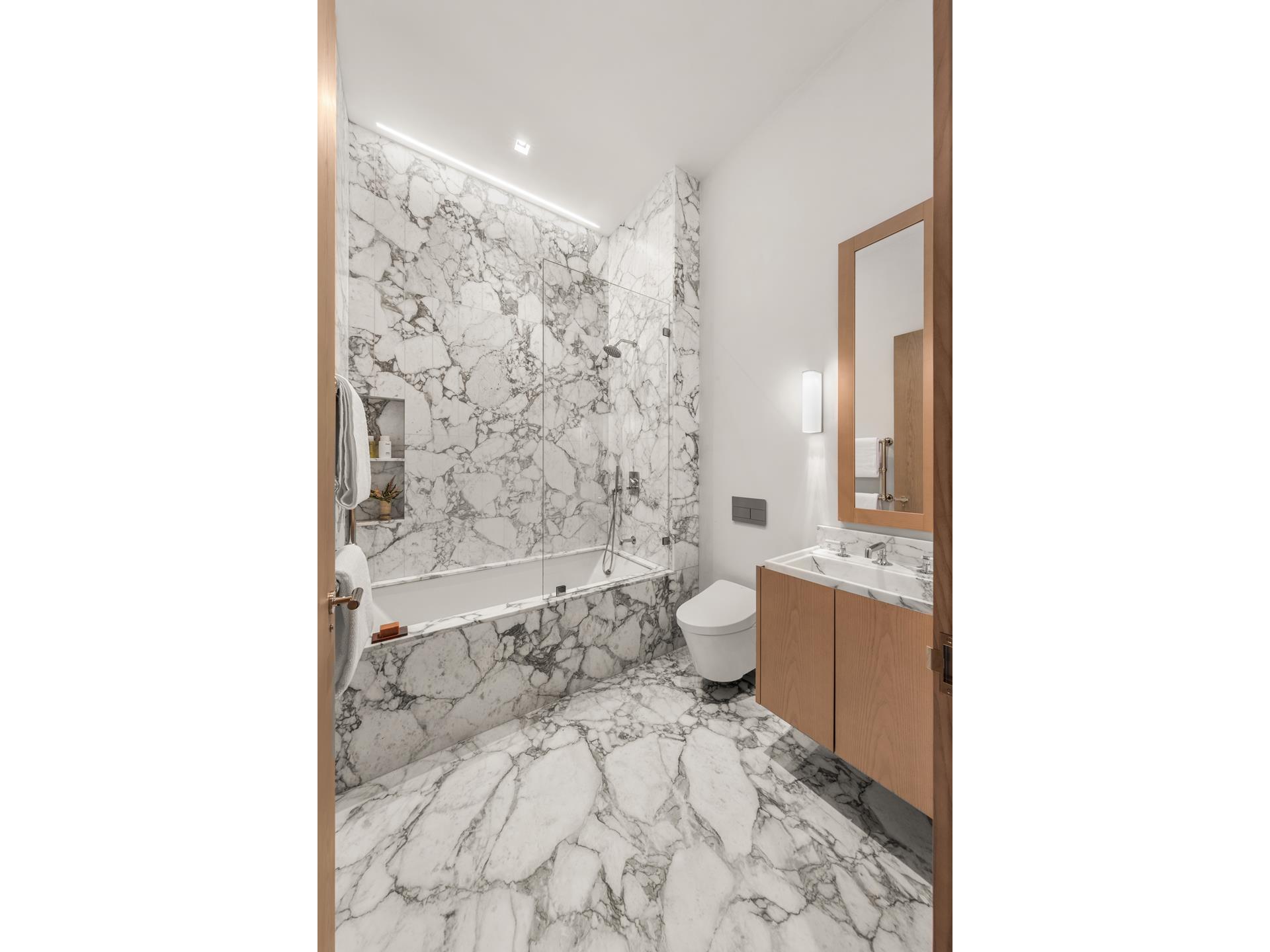 85 Worth Street, Unit 5 Manhattan, NY 10013 - Photo 8 of 20 a bathroom with a toilet a sink and a bathtub