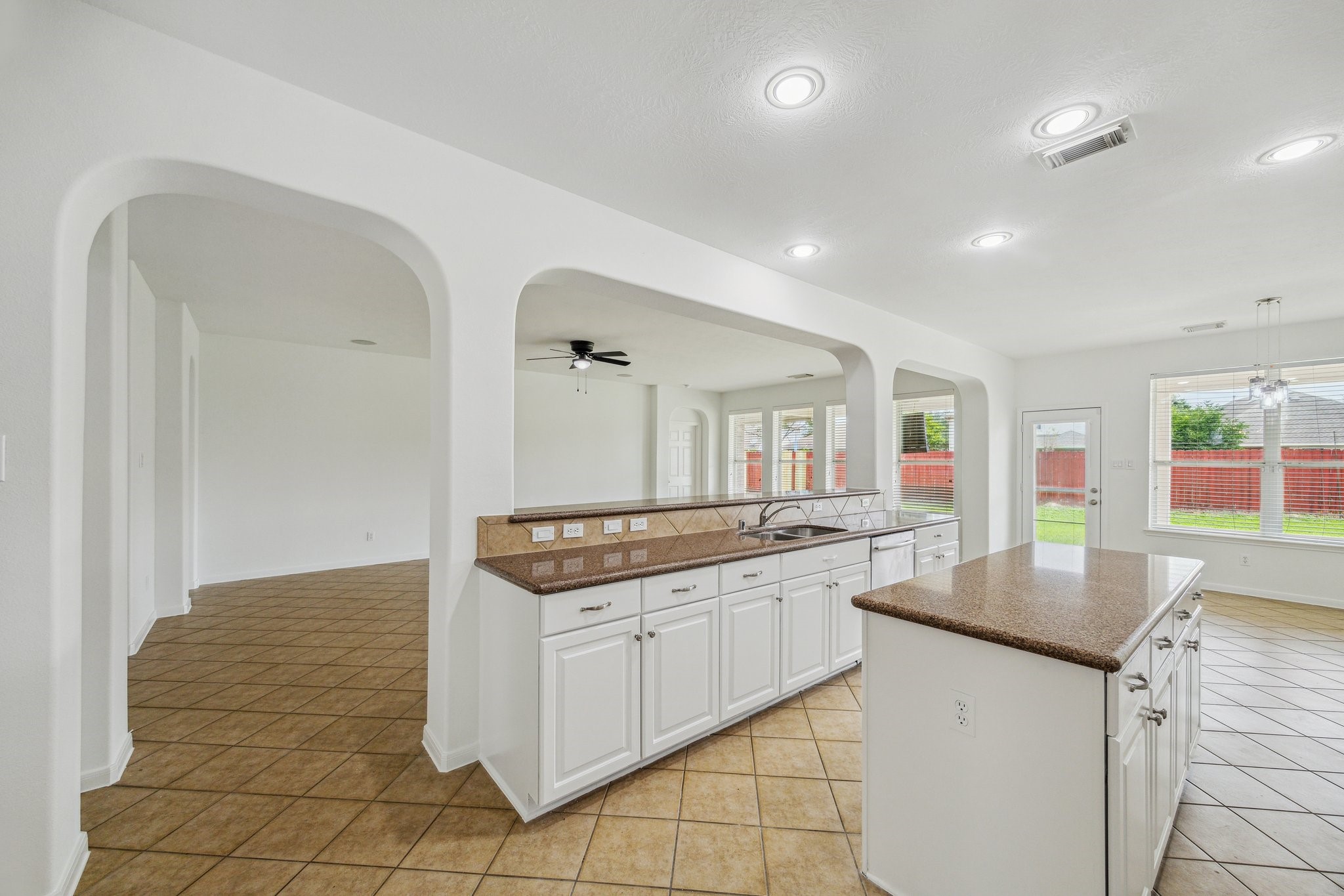 26402 Larkspur Ridge Drive Katy, TX 77494 - Photo 12 of 34 a kitchen with granite countertop a sink and cabinets