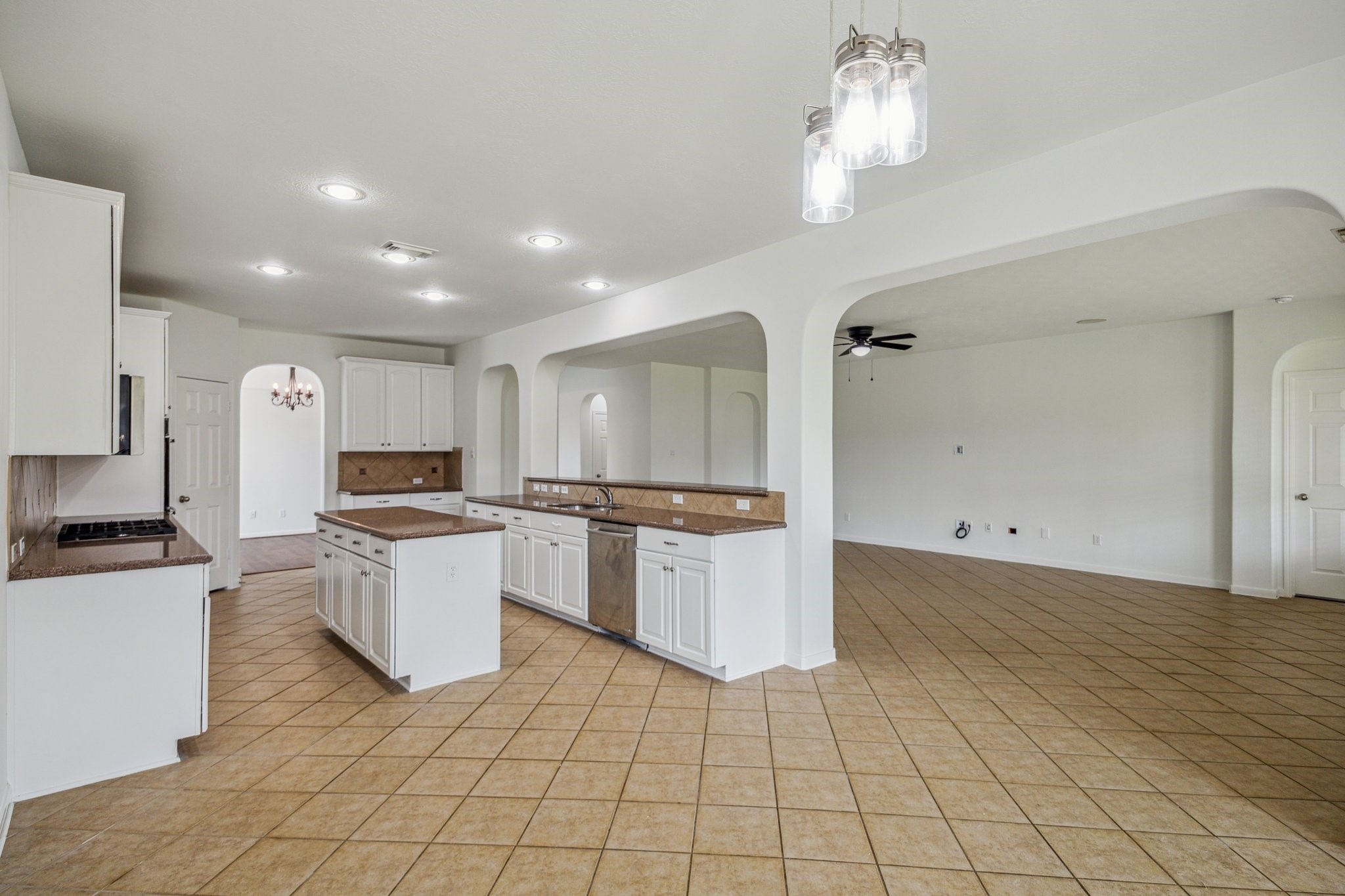 26402 Larkspur Ridge Drive Katy, TX 77494 - Photo 14 of 34 a kitchen with a stove a sink and a refrigerator