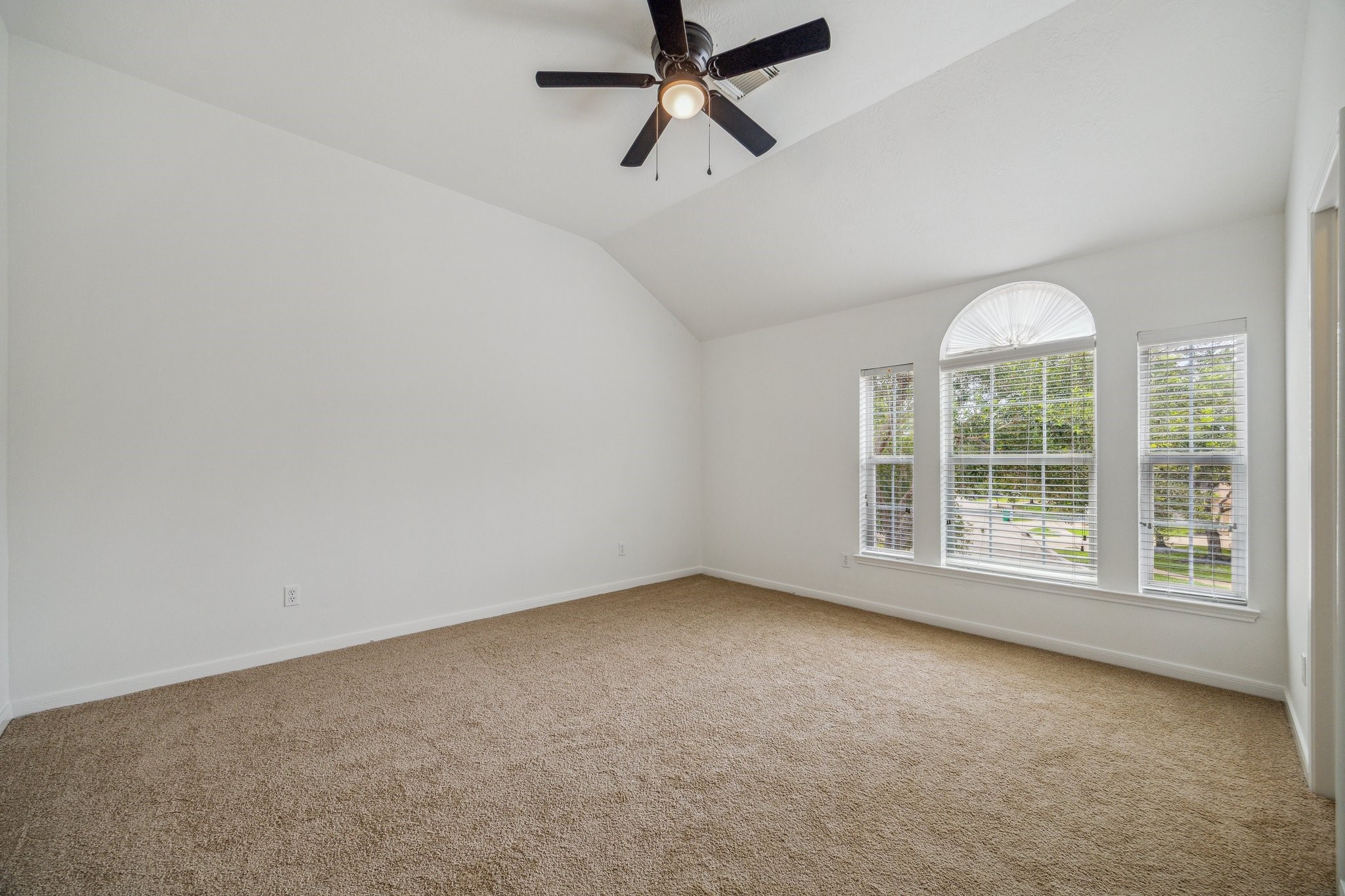 26402 Larkspur Ridge Drive Katy, TX 77494 - Photo 25 of 34 an empty room with a window and a fan