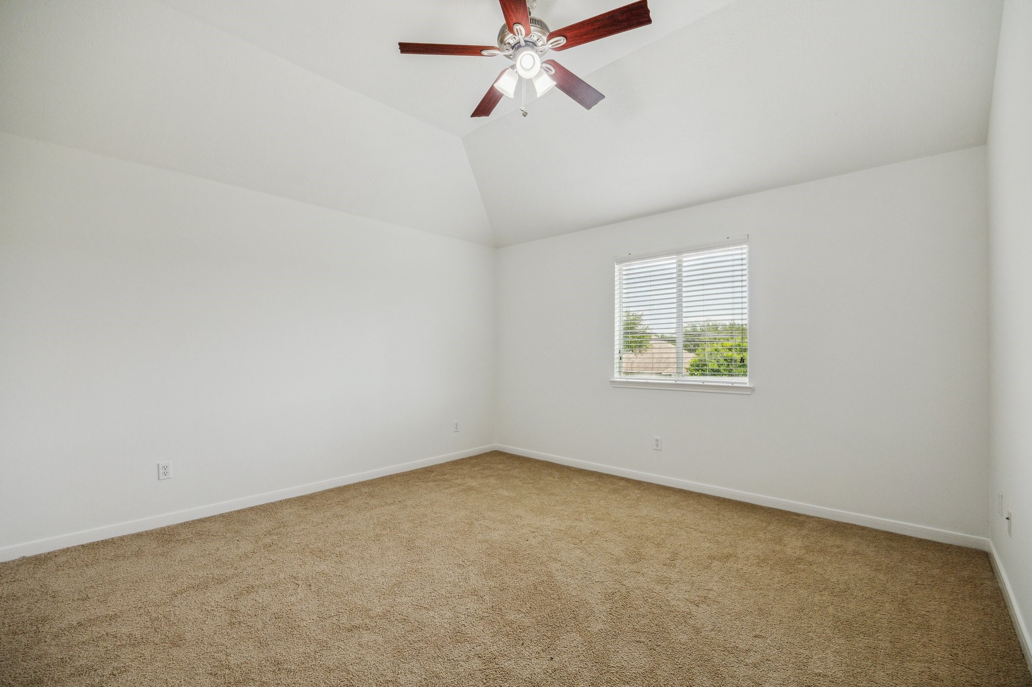 26402 Larkspur Ridge Drive Katy, TX 77494 - Photo 26 of 34 an empty room with a window and a ceiling fan