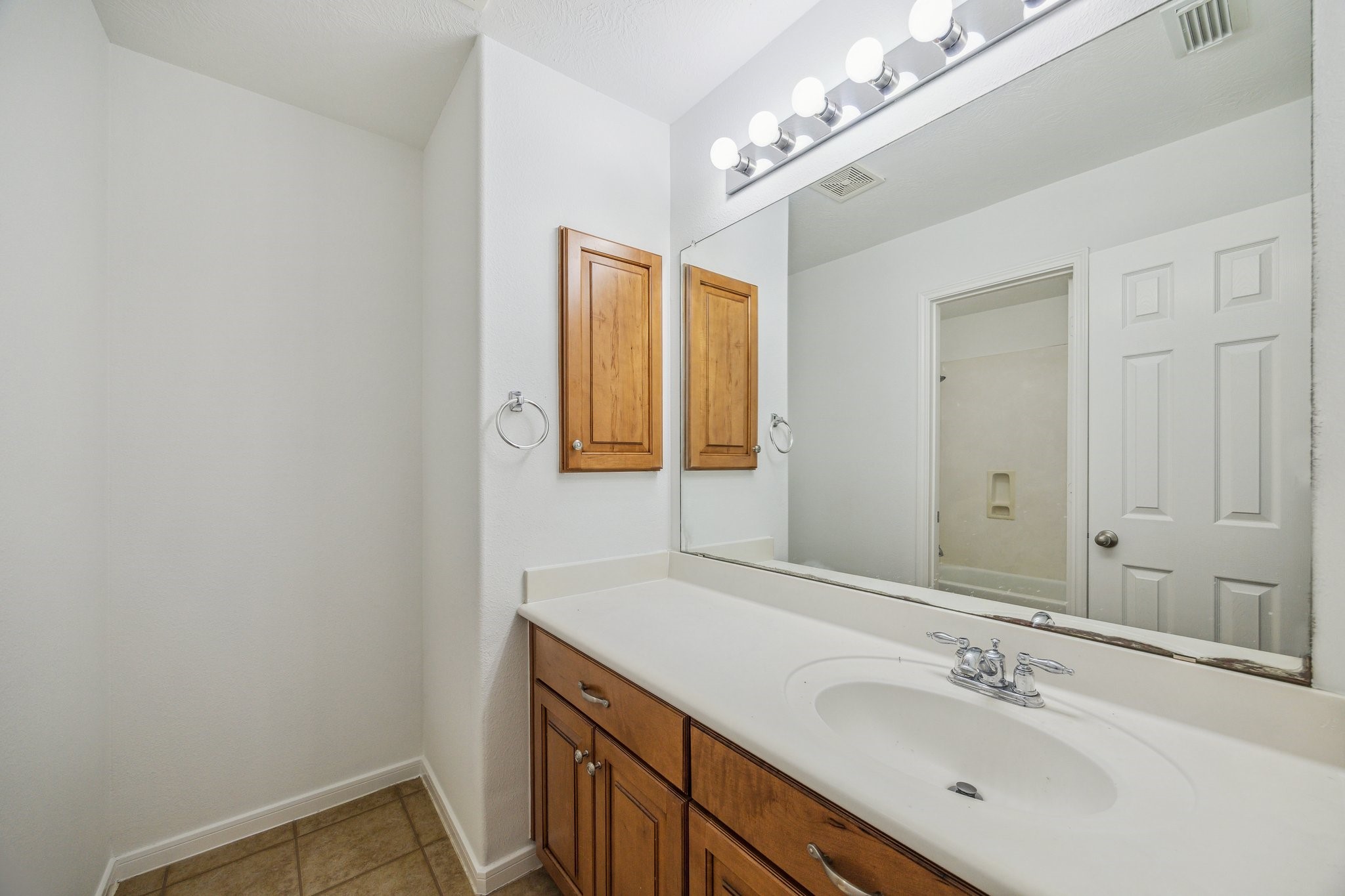 26402 Larkspur Ridge Drive Katy, TX 77494 - Photo 28 of 34 a bathroom with a sink and a mirror