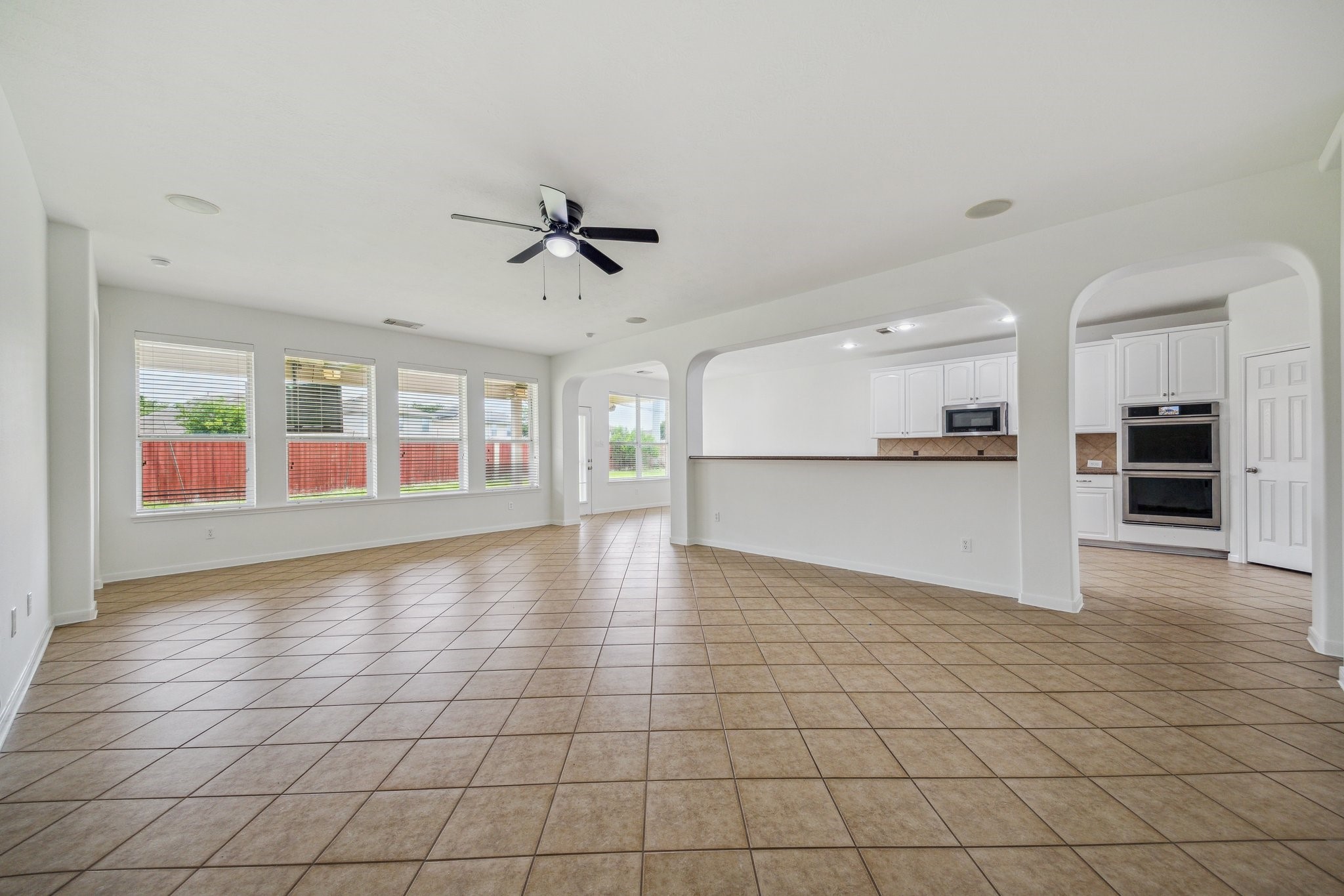 26402 Larkspur Ridge Drive Katy, TX 77494 - Photo 7 of 34 a view of a kitchen with an empty space and a window
