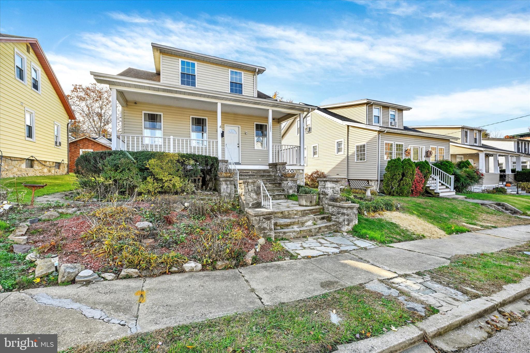 1203 Fairfield Avenue Baltimore, MD 21209 - Photo 1 of 32 a front view of a house with garden