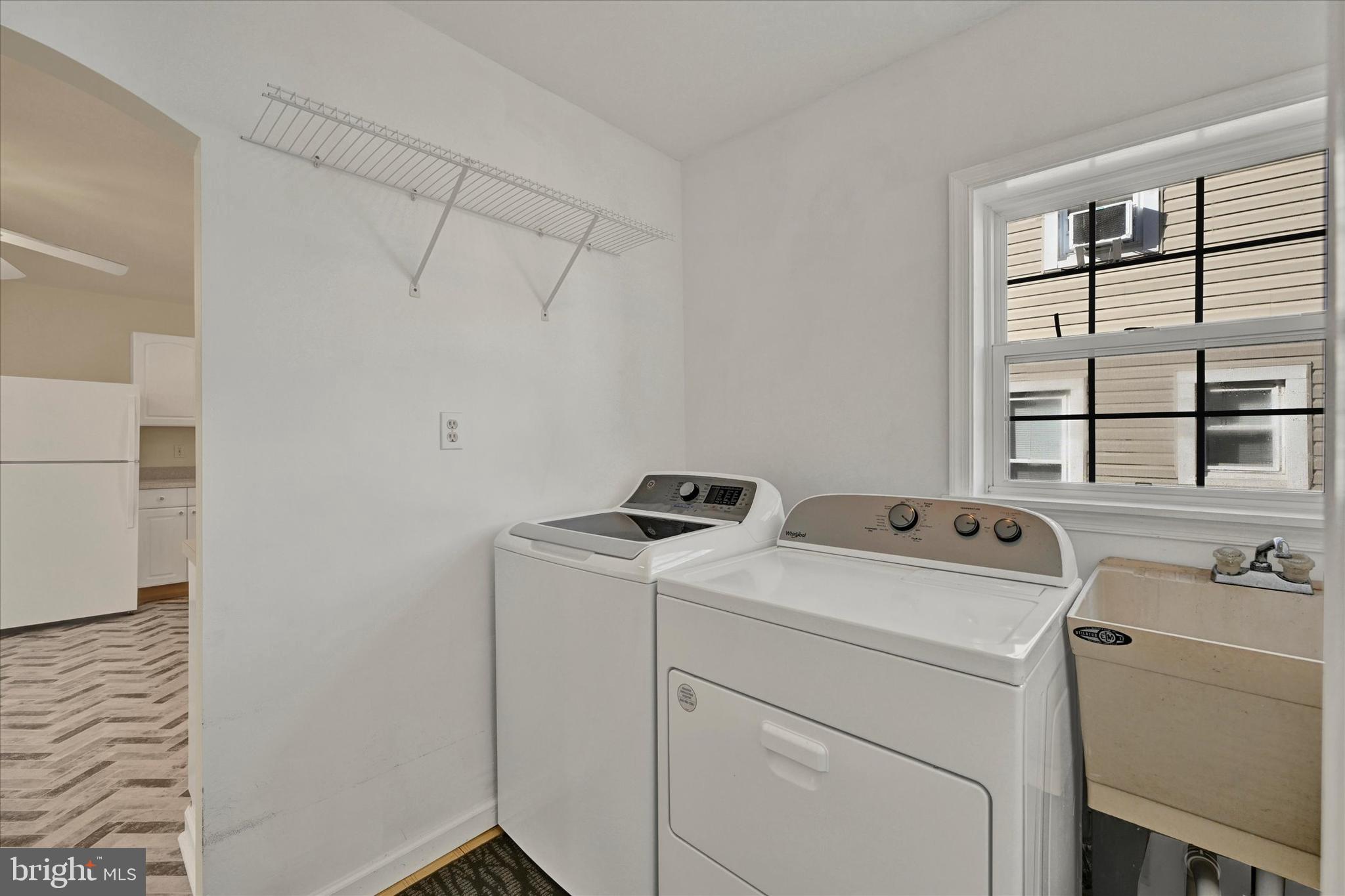 1203 Fairfield Avenue Baltimore, MD 21209 - Photo 13 of 32 a utility room with dryer and washer
