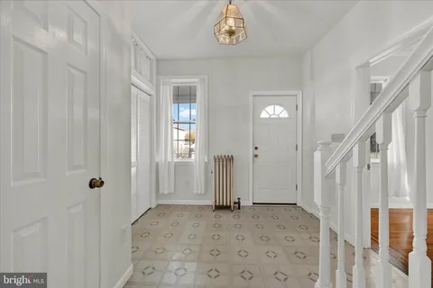 a view of a hallway with a dining area