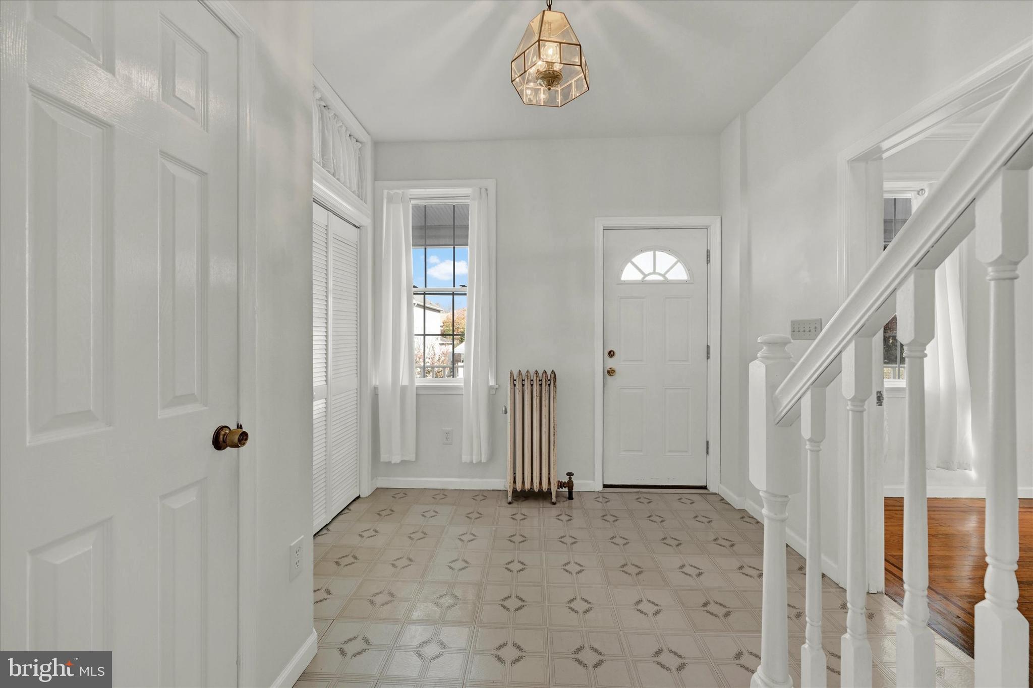 1203 Fairfield Avenue Baltimore, MD 21209 - Photo 14 of 32 a view of a hallway with a dining area