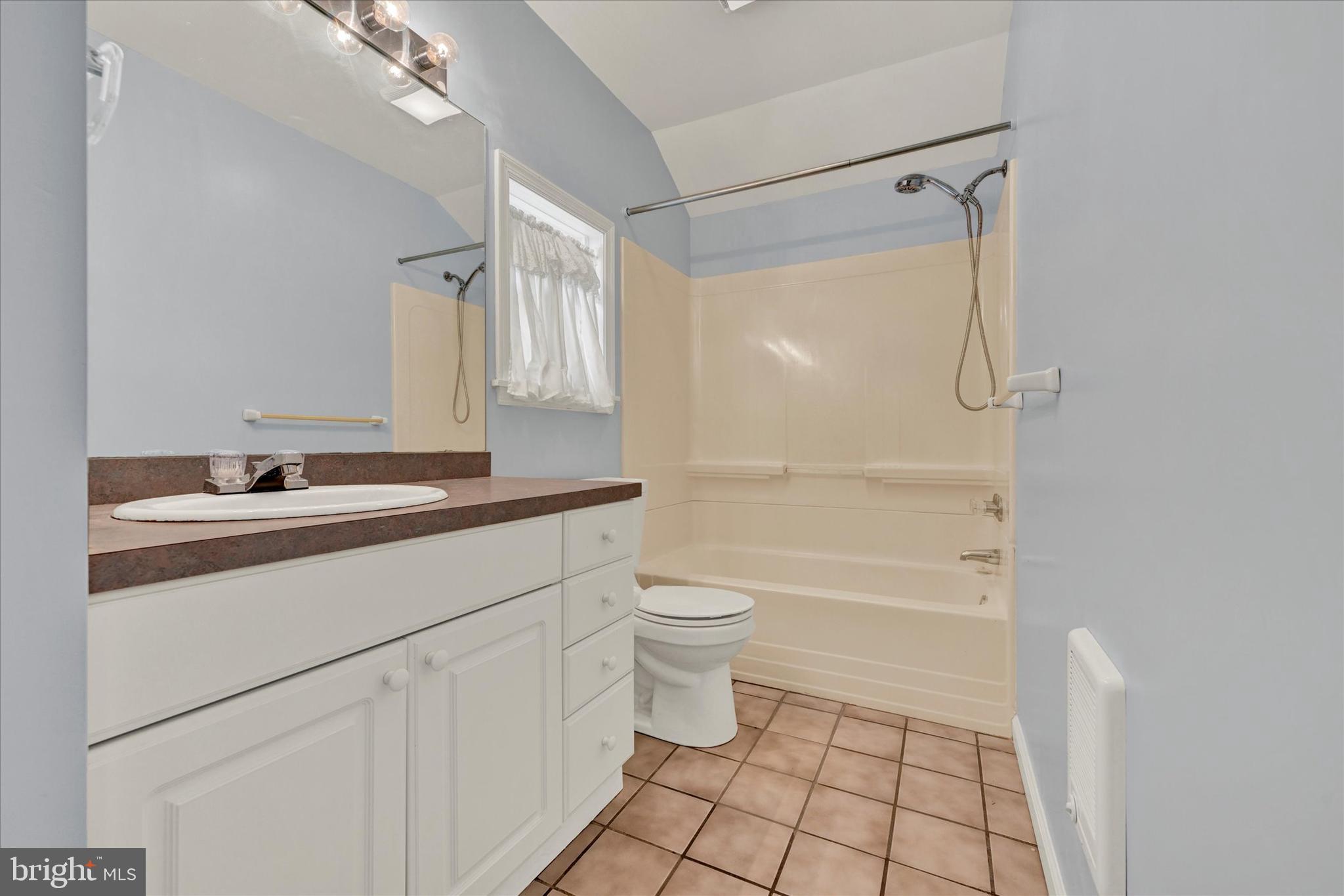 1203 Fairfield Avenue Baltimore, MD 21209 - Photo 23 of 32 a bathroom with a sink a toilet and shower