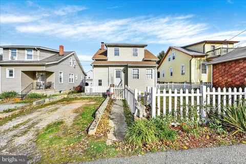 a front view of a house with a porch