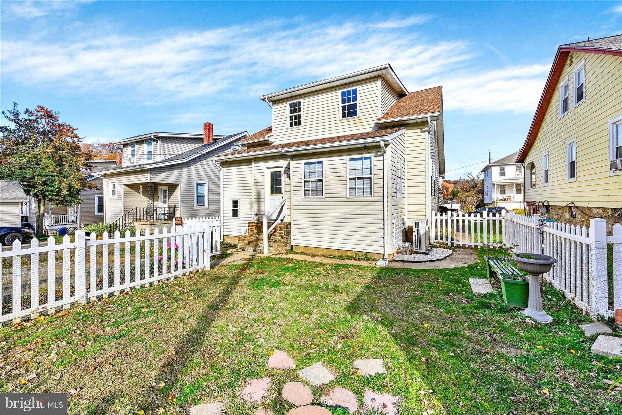 1203 Fairfield Avenue Baltimore, MD 21209 - Photo 26 of 32 a front view of a house with a garden