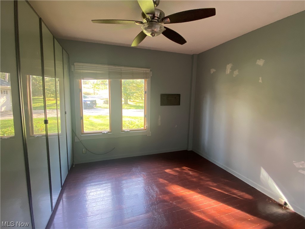 56 North Hametown Road Akron, OH 44321 - Photo 19 of 41 Master bedroom room featuring dark hardwood / wood-style flooring and ceiling fan