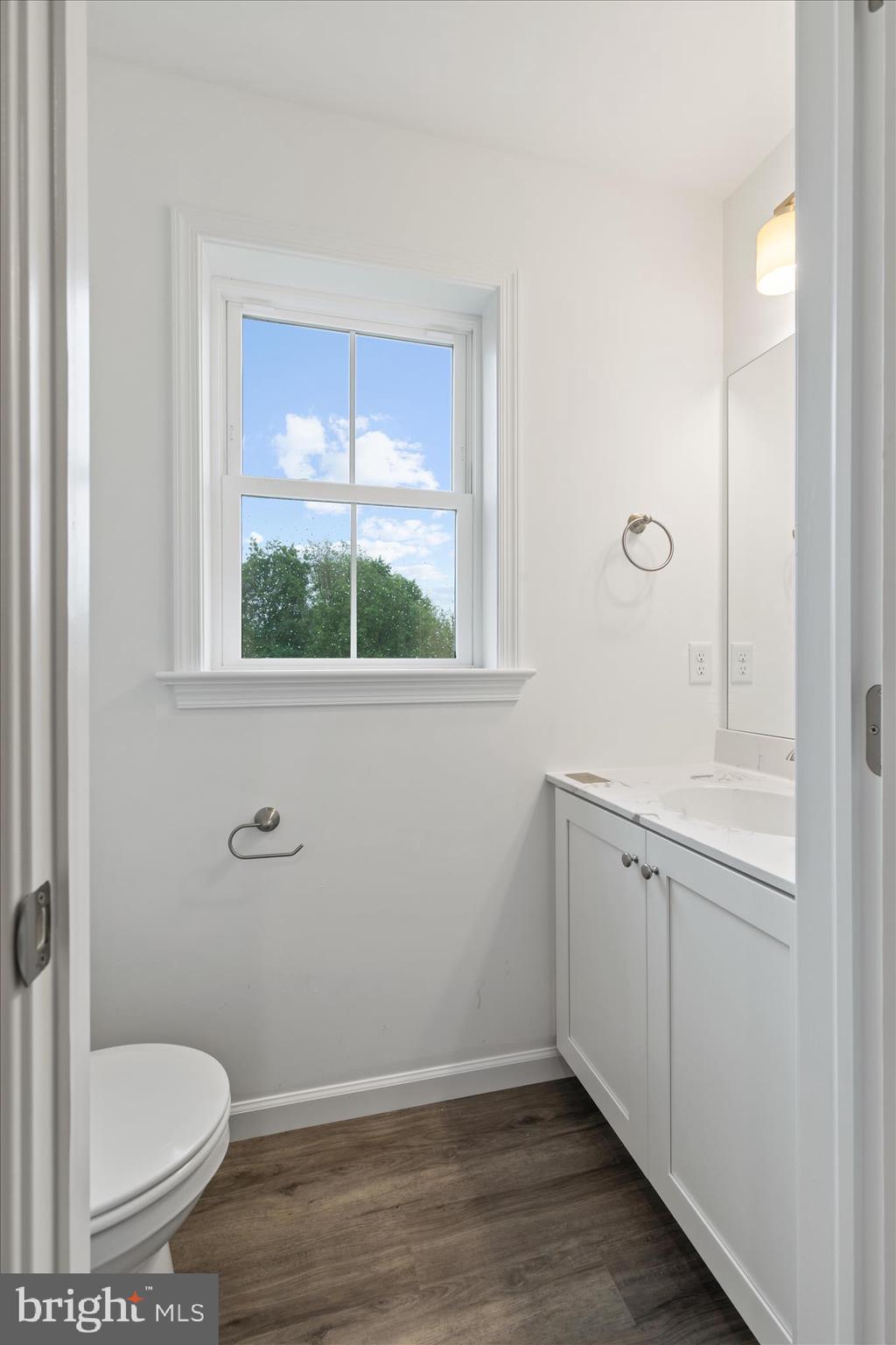 10 Stream Drive Carlisle, PA 17013 - Photo 14 of 48 a bathroom with a granite countertop toilet a sink and a window