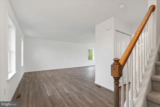 a view of stairs and with wooden floor