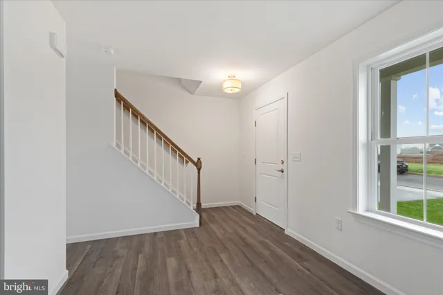 a view of entryway with wooden floor