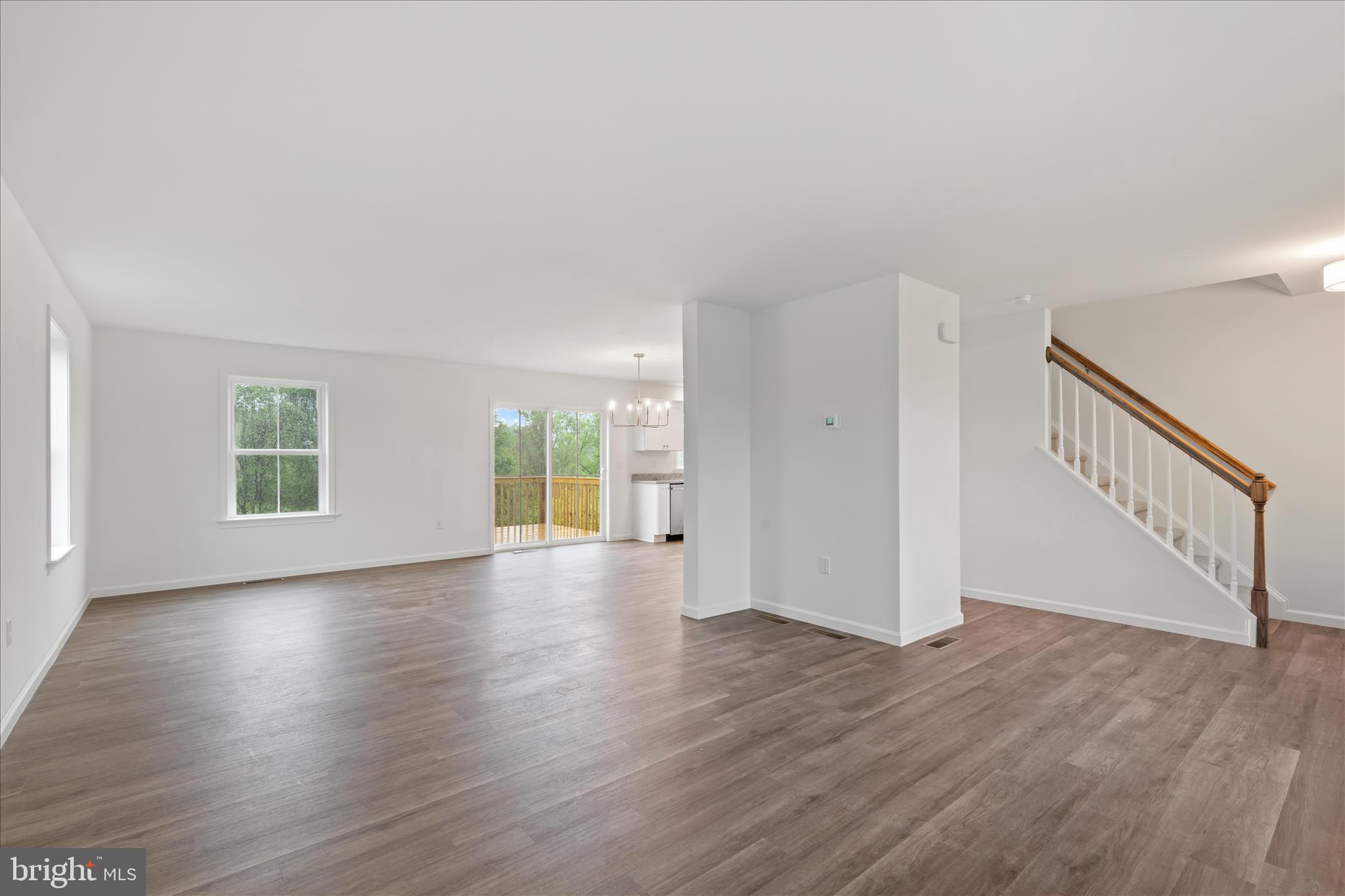 10 Stream Drive Carlisle, PA 17013 - Photo 6 of 48 a view of an empty room with wooden floor and a window