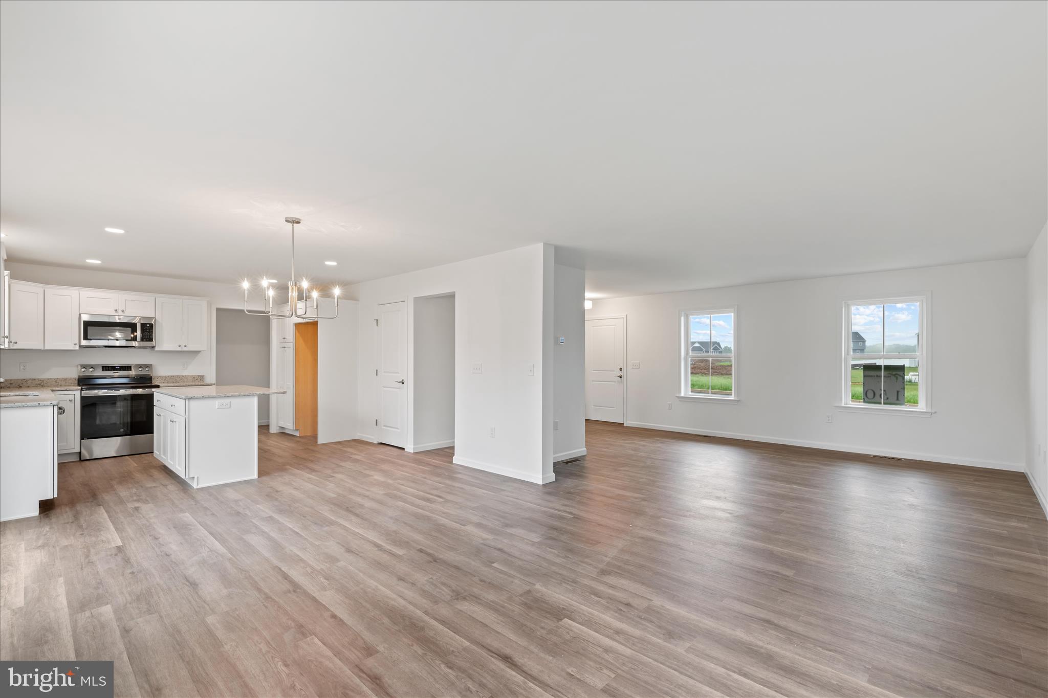10 Stream Drive Carlisle, PA 17013 - Photo 7 of 48 a view of an empty room with window and wooden floor