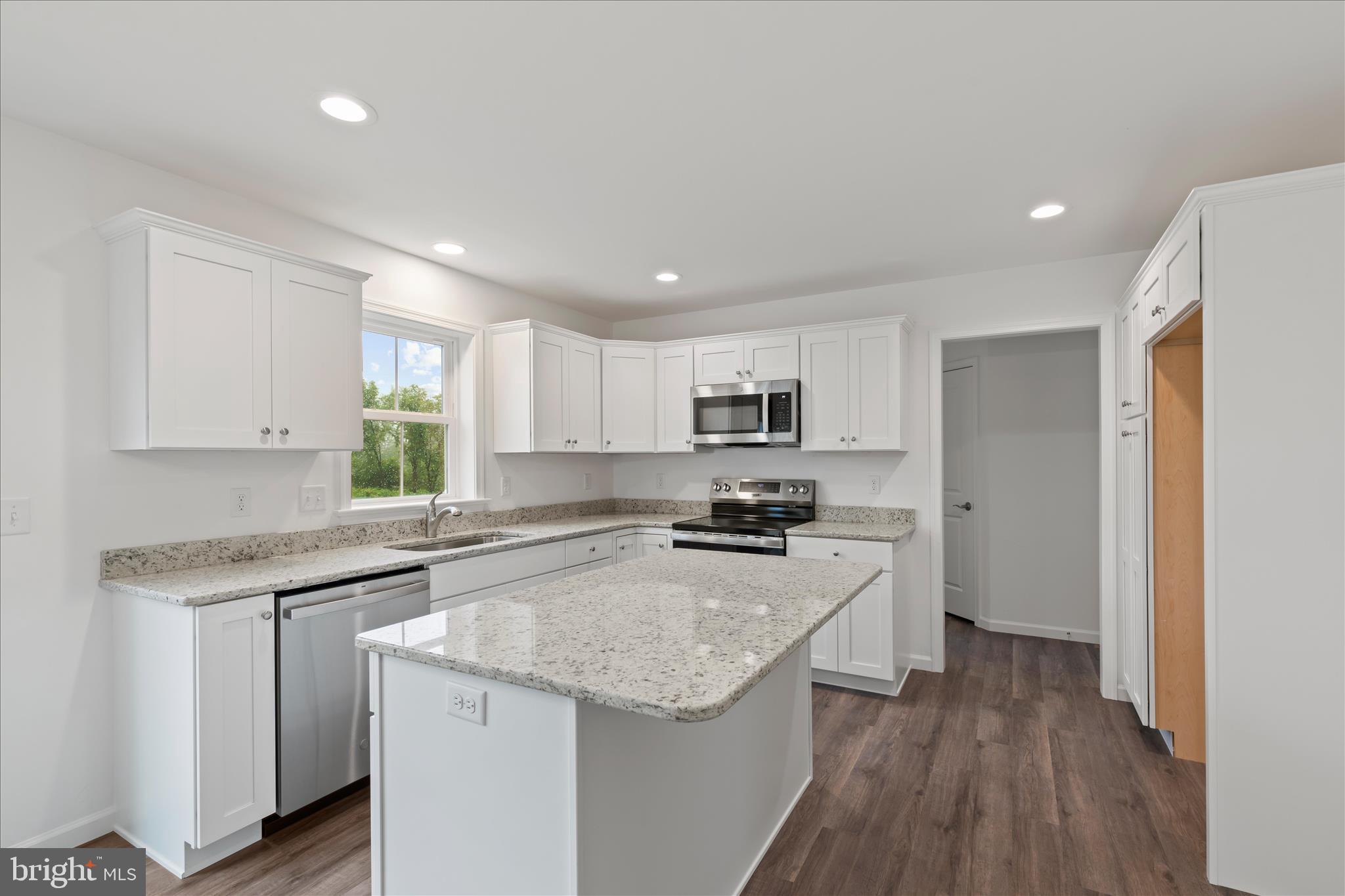 10 Stream Drive Carlisle, PA 17013 - Photo 9 of 48 a kitchen with stainless steel appliances granite countertop a sink stove and refrigerator