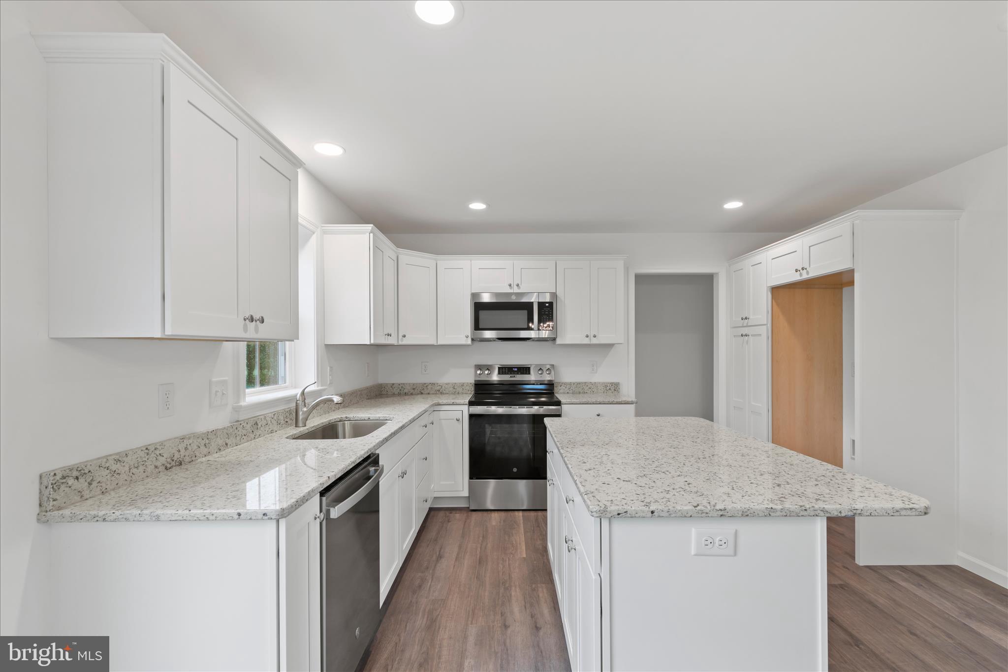 10 Stream Drive Carlisle, PA 17013 - Photo 10 of 48 a kitchen with a sink a stove and refrigerator