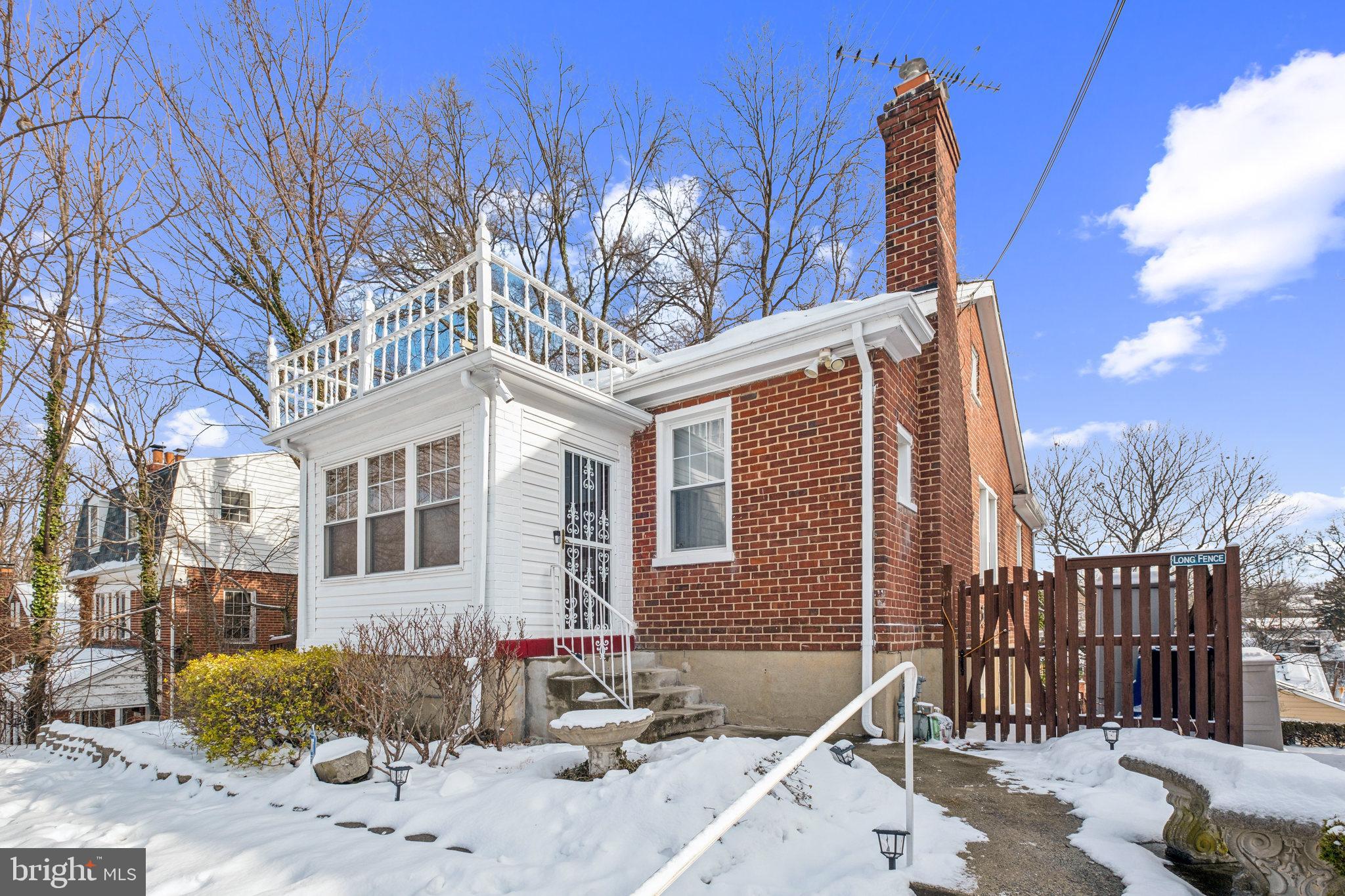 a view of a house with a snow in the yard