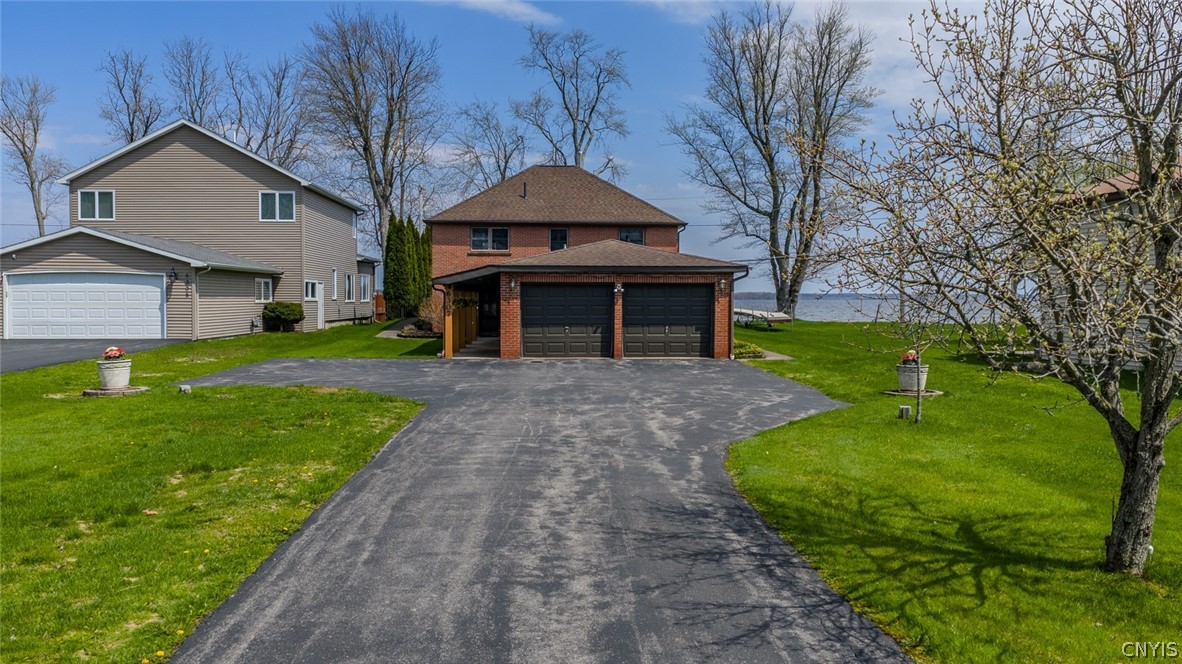 6307 Muskrat Bay Road Cicero, NY 13029 - Photo 3 of 47 Offering a 2 car garage with ample space for stora