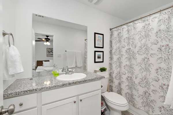 a bedroom with bed and a window