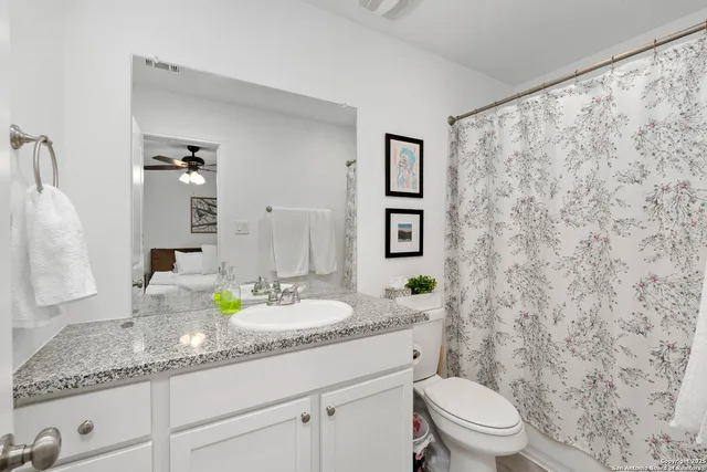 a bedroom with bed and a window