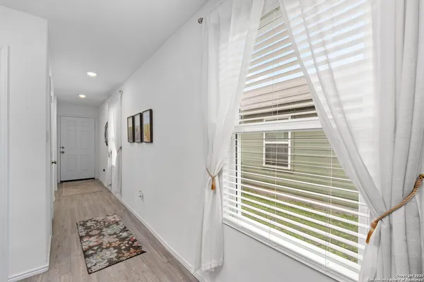 a view of a hallway with windows