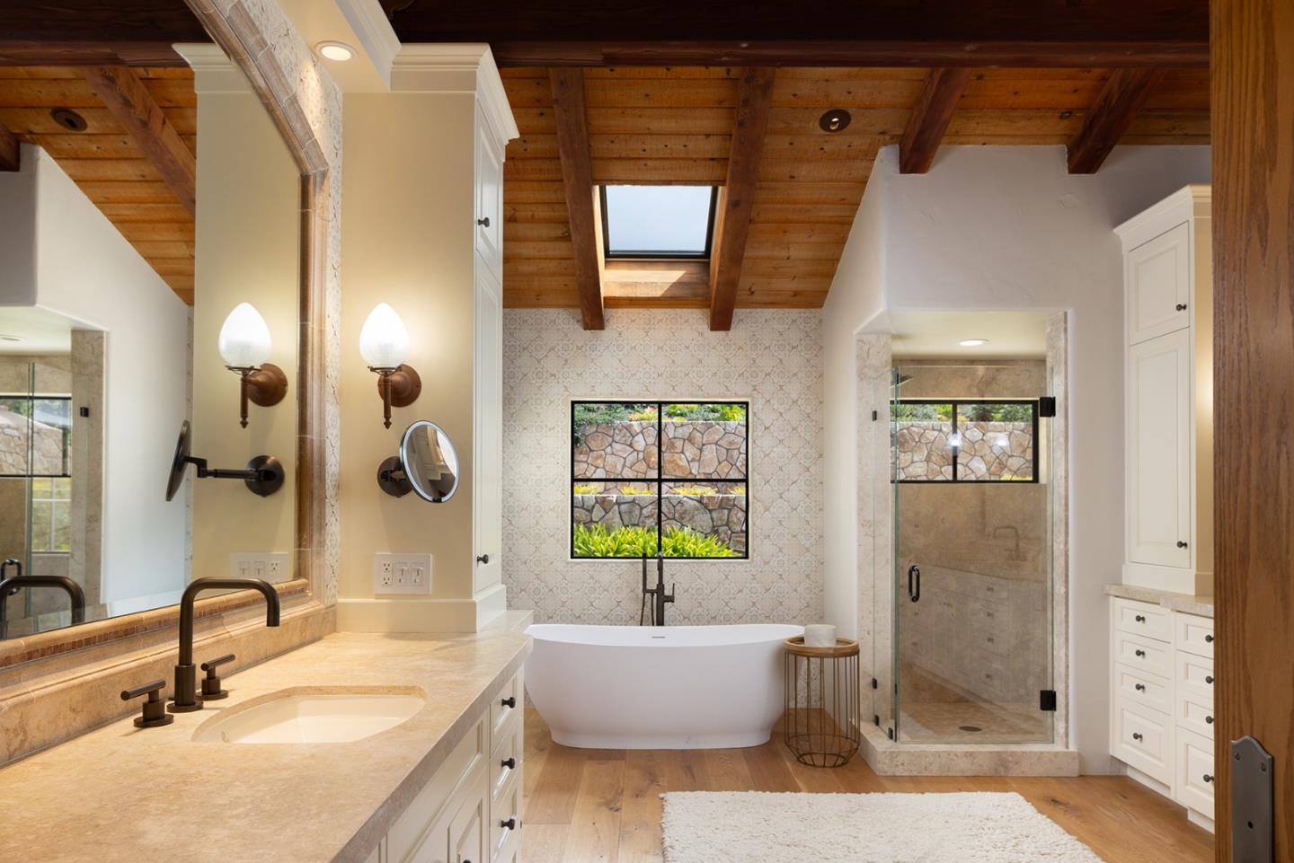 31453 Highway 1 Carmel, CA 93923 - Photo 38 of 58 a bathroom with a granite countertop sink a toilet a mirror and shower