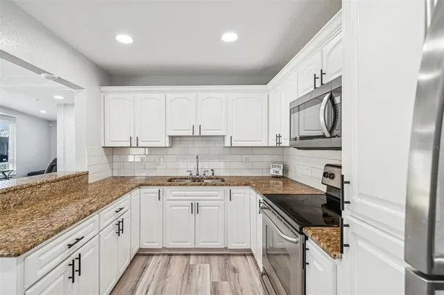 a kitchen with a sink and cabinets