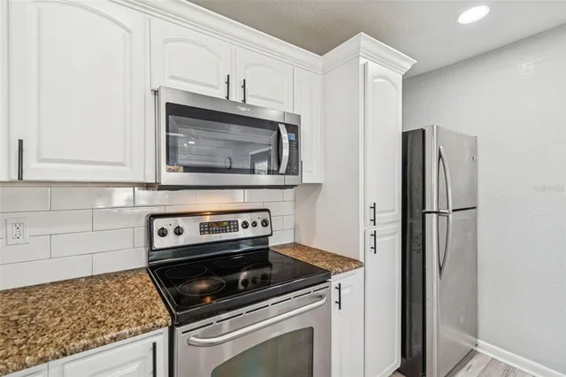a white toilet sitting next to a shower curtain