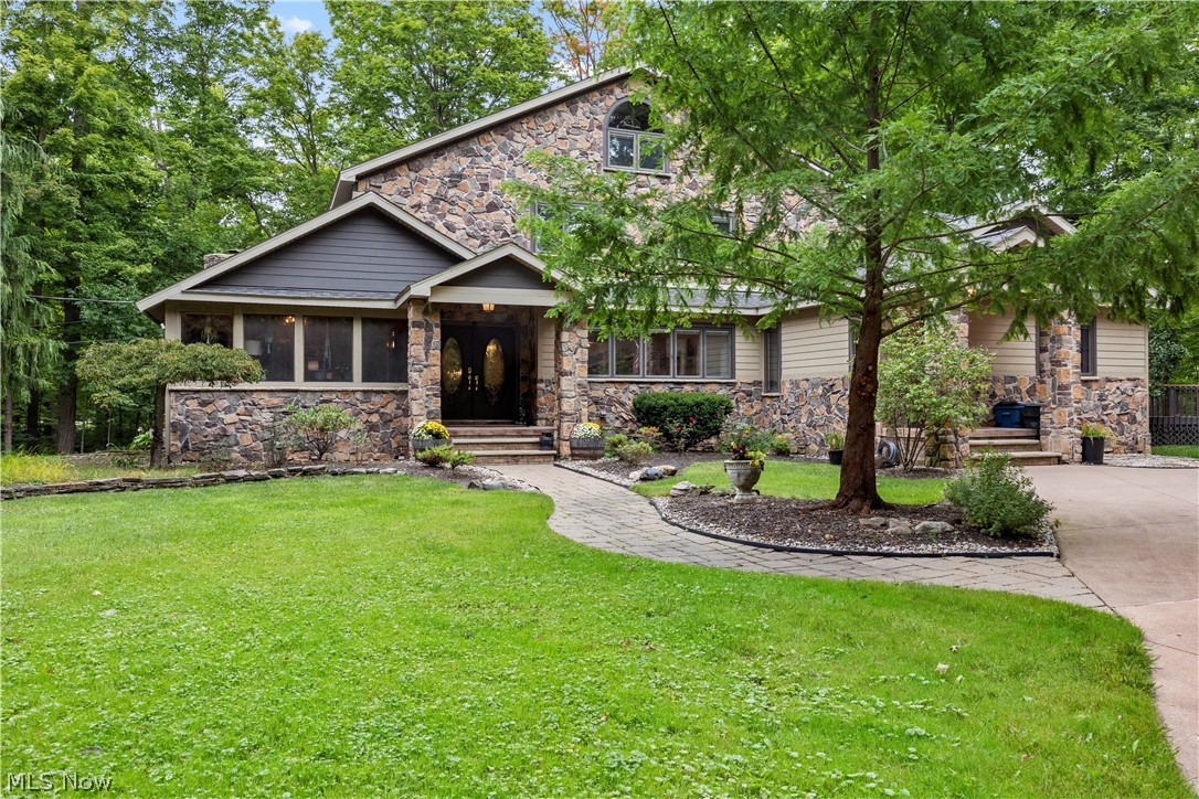 7587 Lewis Road Olmsted Falls, OH 44138 - Photo 1 of 50 Stone and siding exterior with a gabled roofline