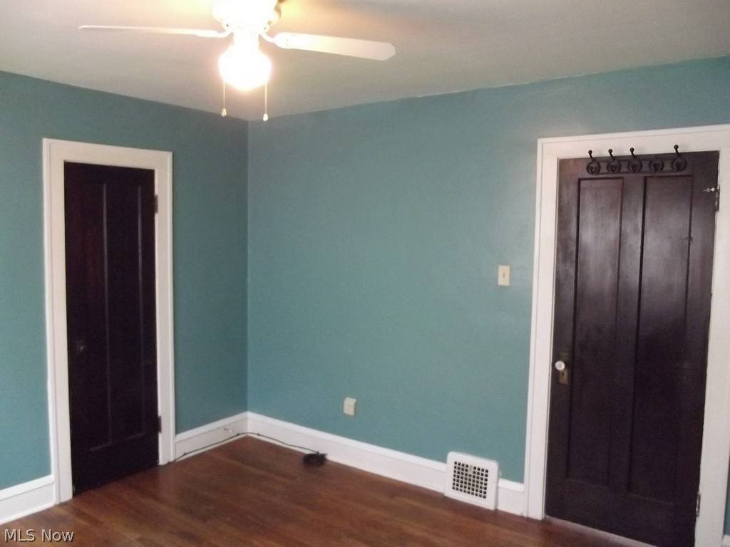 3363 Berea Road Cleveland, OH 44111 - Photo 30 of 50 Unfurnished bedroom featuring a closet, ceiling fan, and dark wood-type flooring