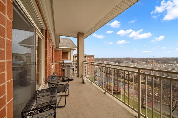 a view of balcony with furniture