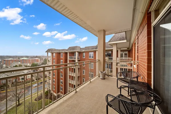 a view of a balcony with chairs