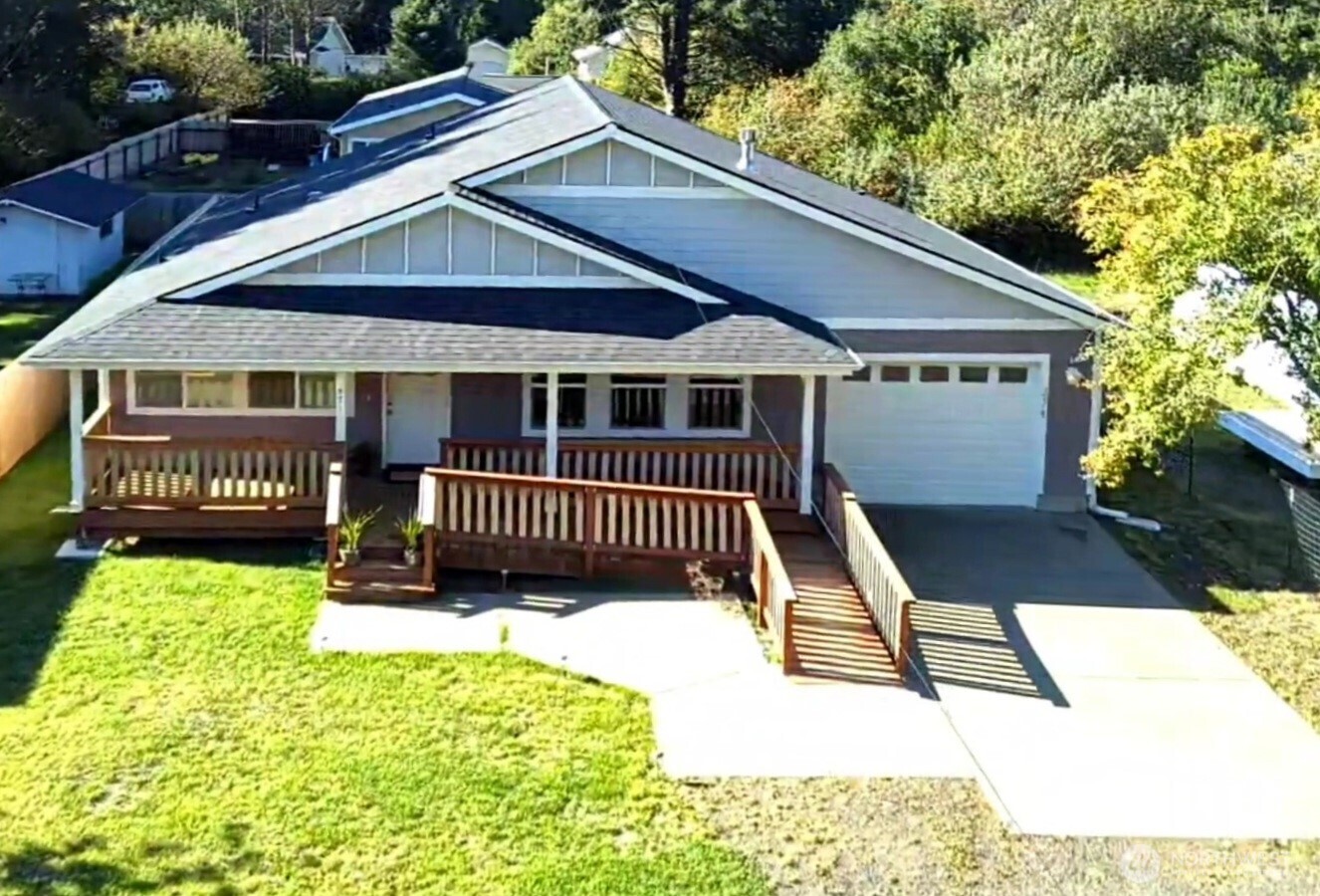 371 Centaurus Avenue Southwest Ocean Shores, WA 98569 - Photo 1 of 40 a balcony with a table and chairs