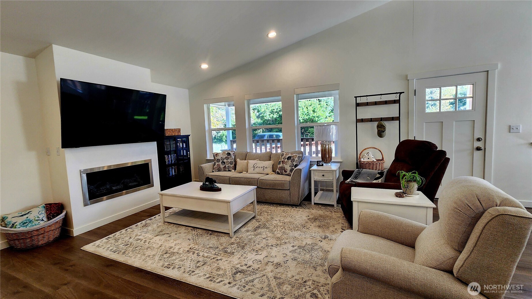 371 Centaurus Avenue Southwest Ocean Shores, WA 98569 - Photo 13 of 40 a living room with furniture a flat screen tv and a fireplace