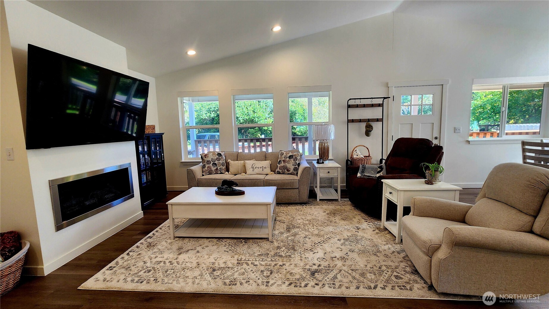 371 Centaurus Avenue Southwest Ocean Shores, WA 98569 - Photo 14 of 40 a living room with furniture a flat screen tv and a fireplace