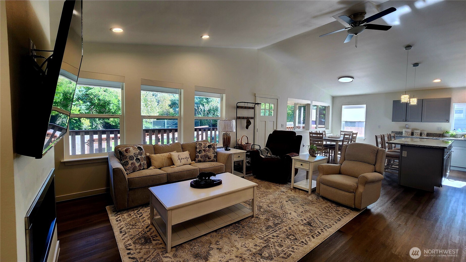 371 Centaurus Avenue Southwest Ocean Shores, WA 98569 - Photo 16 of 40 a living room with furniture hard wood floor and a floor to ceiling window