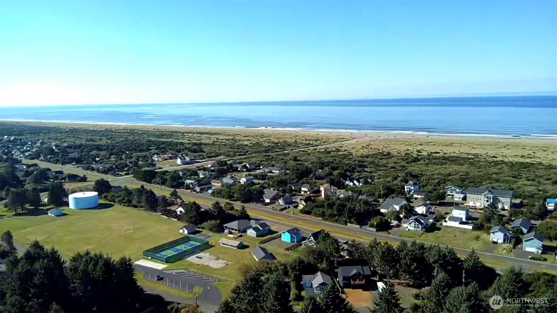 371 Centaurus Avenue Southwest Ocean Shores, WA 98569 - Photo 2 of 40 an aerial view of a city with lots of residential buildings