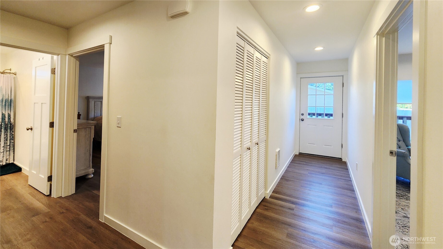 371 Centaurus Avenue Southwest Ocean Shores, WA 98569 - Photo 24 of 40 a view of a hallway with wooden floor and a bathroom
