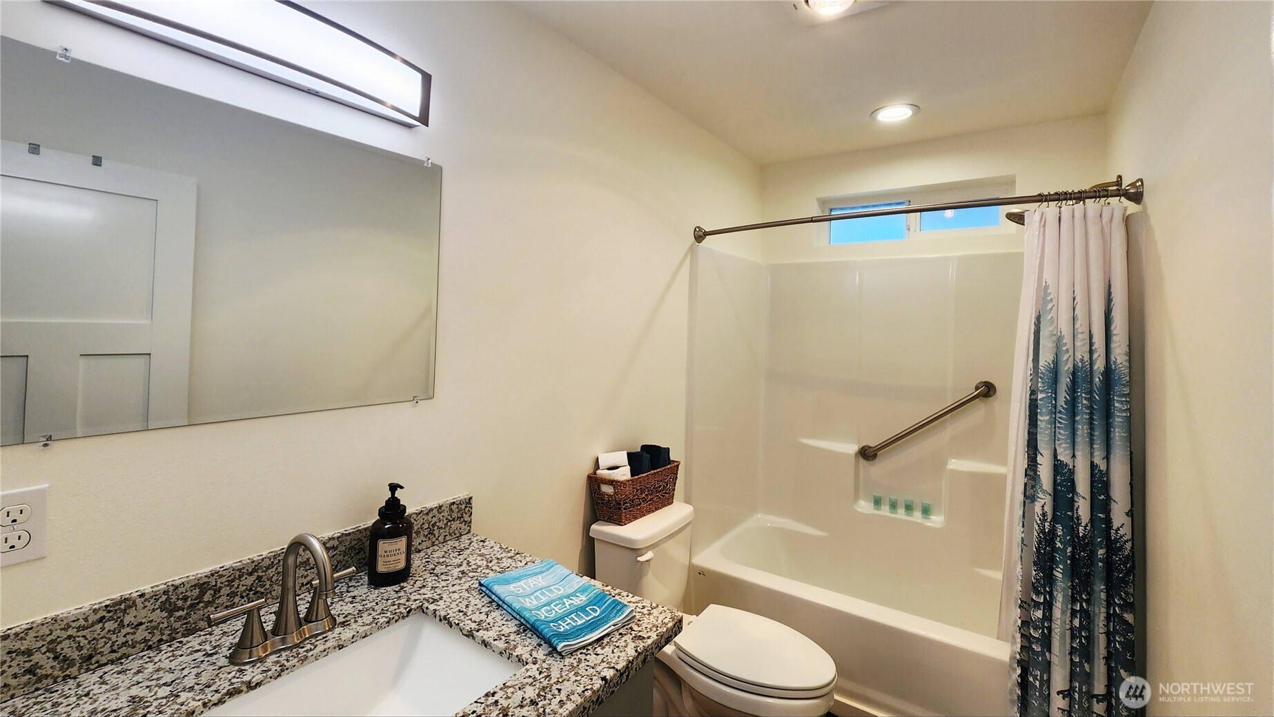 371 Centaurus Avenue Southwest Ocean Shores, WA 98569 - Photo 25 of 40 a bathroom with a granite countertop bathtub sink vanity mirror and toilet