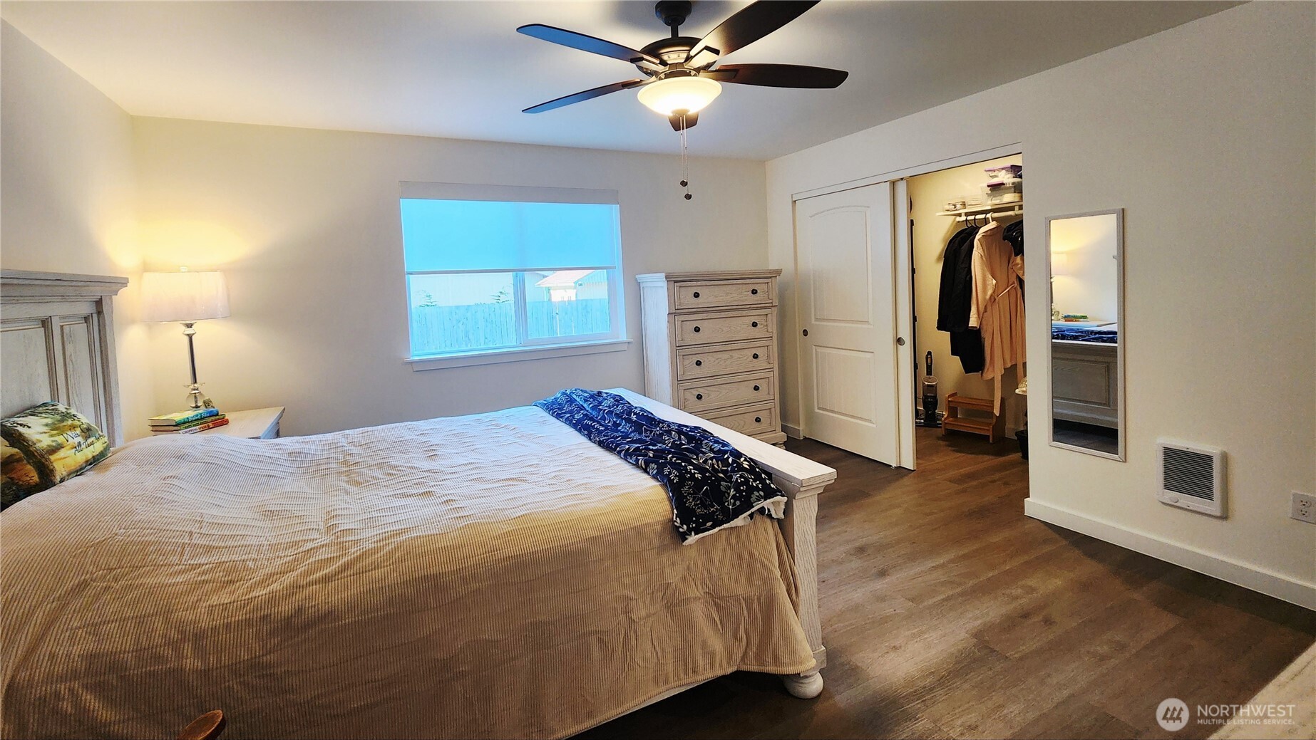 371 Centaurus Avenue Southwest Ocean Shores, WA 98569 - Photo 27 of 40 a bedroom with a bed and a chandelier