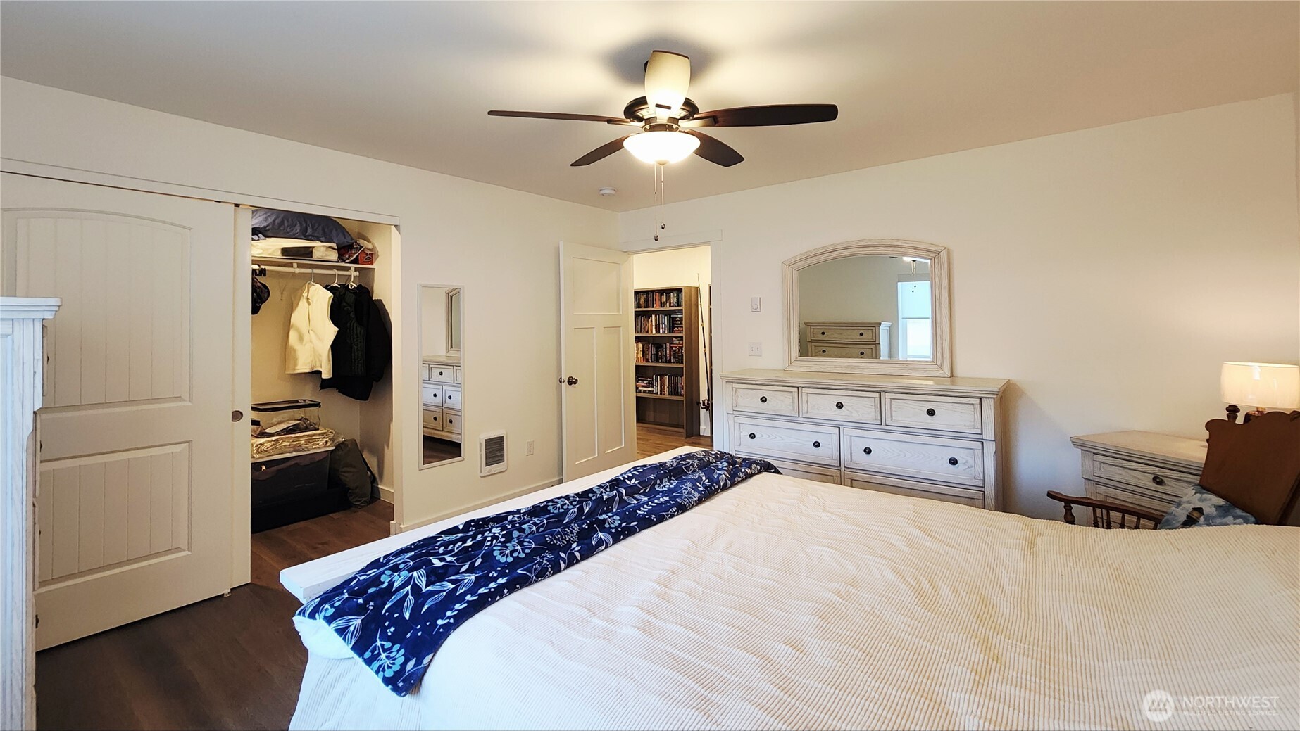 371 Centaurus Avenue Southwest Ocean Shores, WA 98569 - Photo 28 of 40 a bedroom with a bed and a chandelier