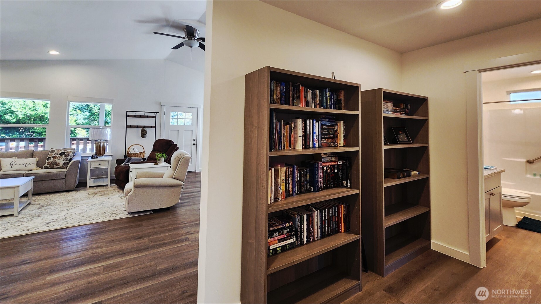 371 Centaurus Avenue Southwest Ocean Shores, WA 98569 - Photo 30 of 40 a living room with furniture and a book shelf