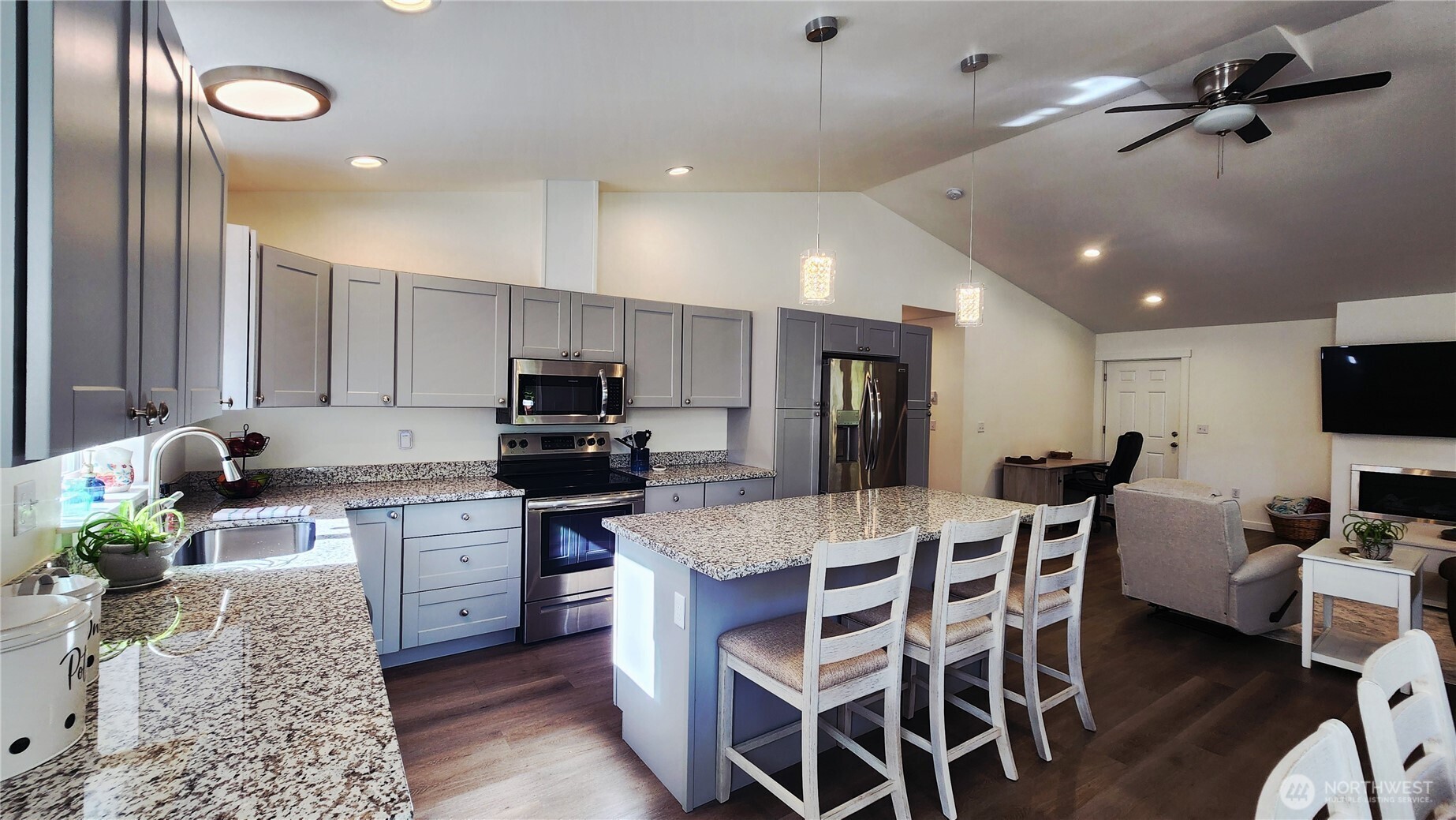 371 Centaurus Avenue Southwest Ocean Shores, WA 98569 - Photo 3 of 40 a large kitchen with a table and chairs