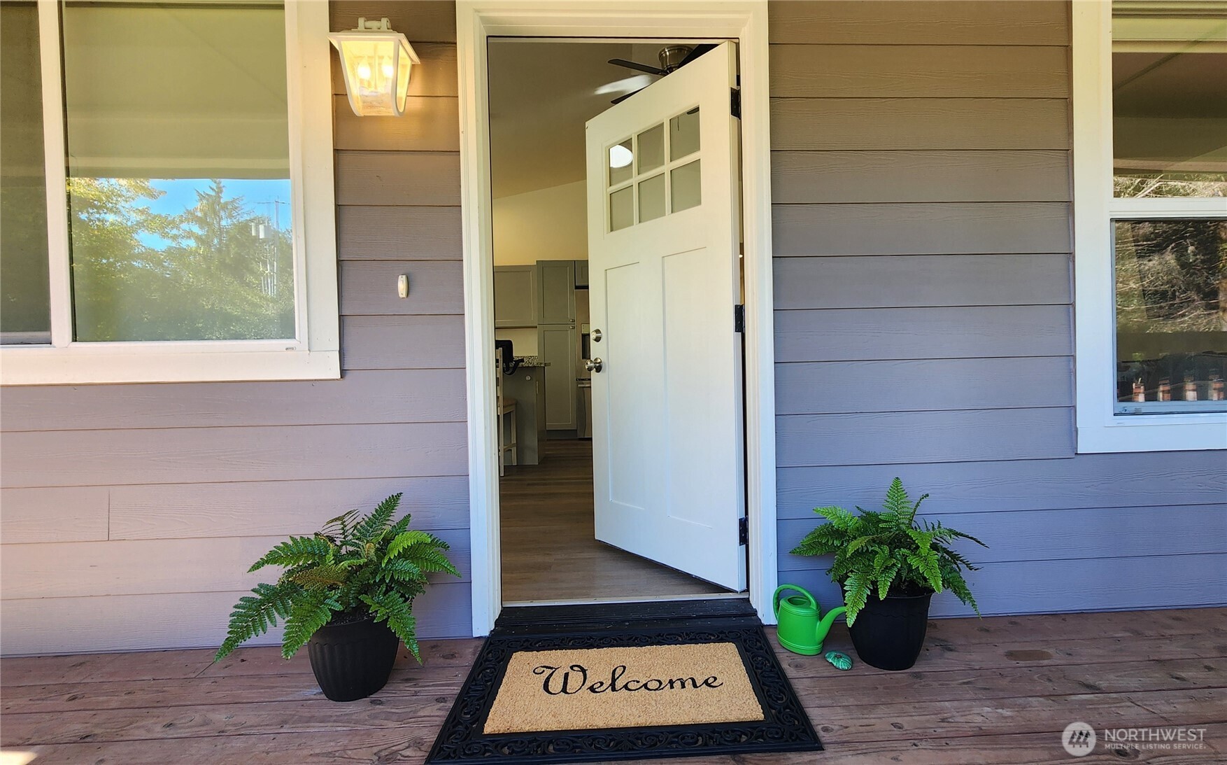 371 Centaurus Avenue Southwest Ocean Shores, WA 98569 - Photo 31 of 40 a view of a door and a potted plant